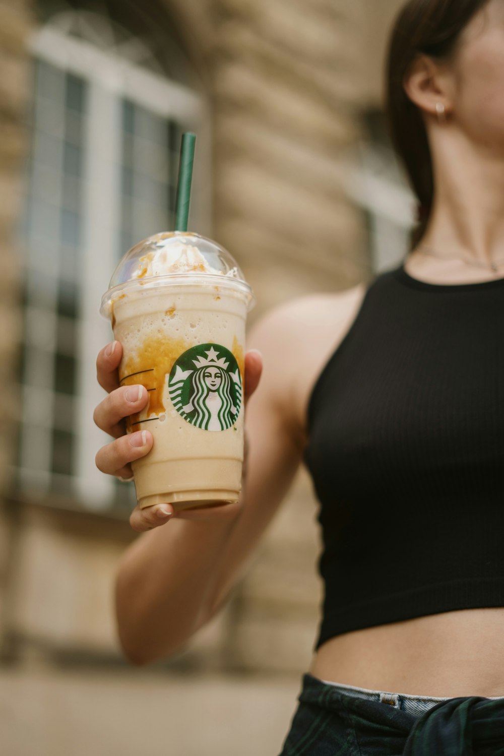 a person holding a cup of coffee