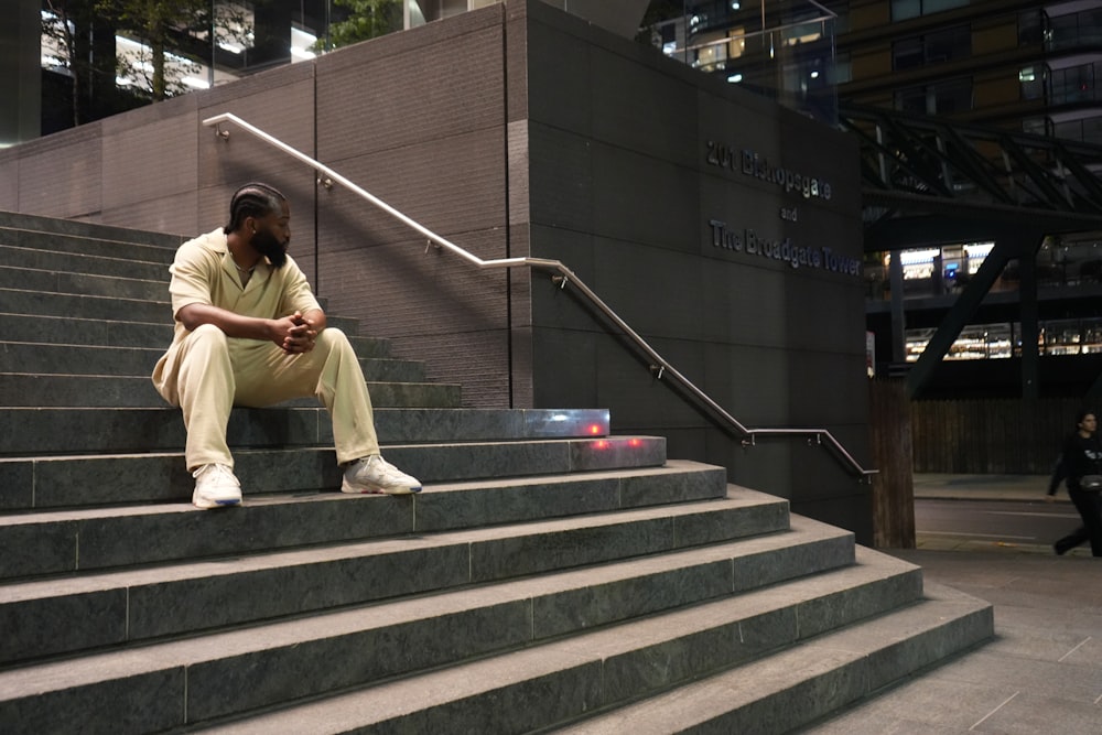 a man sitting on stairs