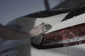 a hand holding a piece of paper