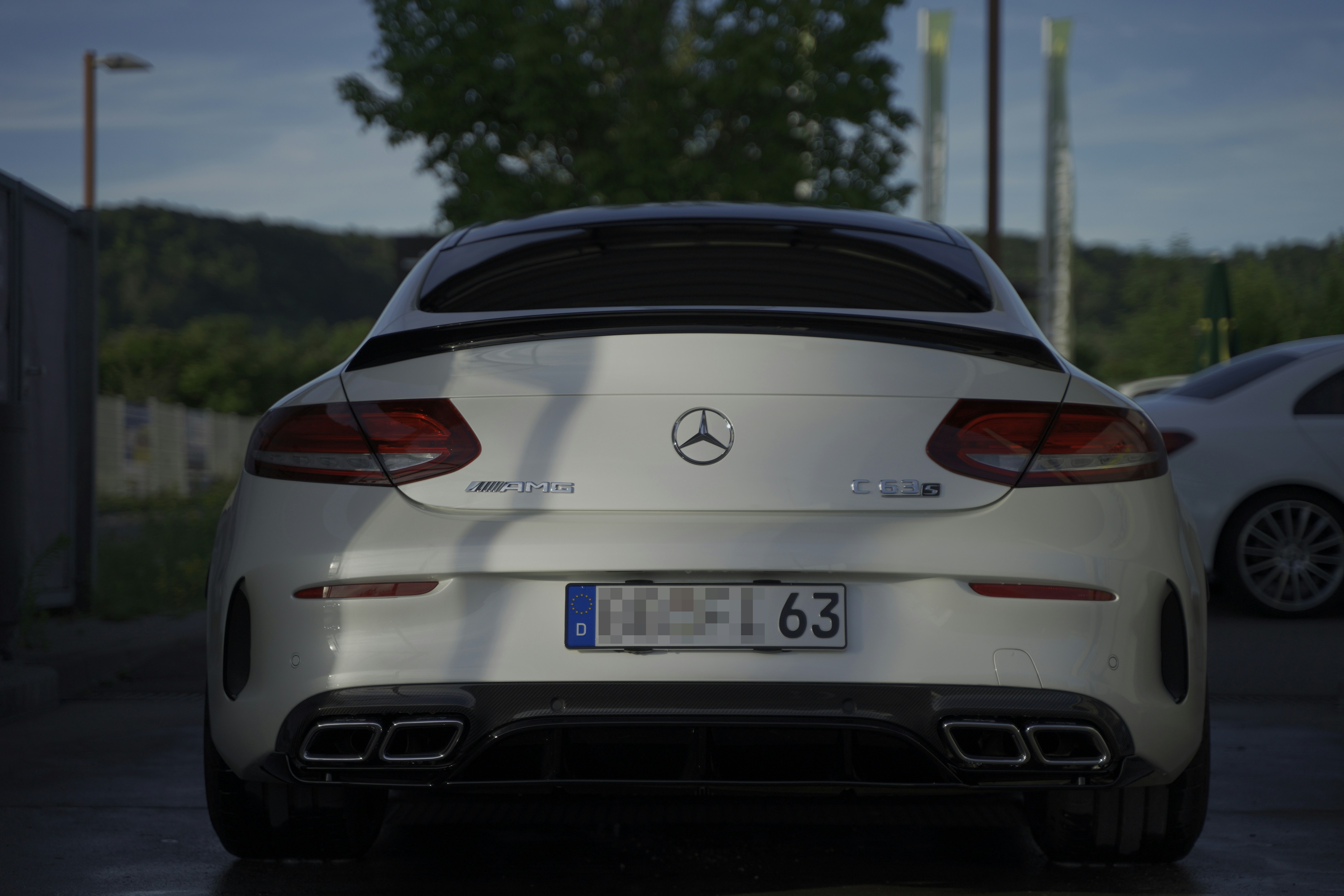 a white car parked on a street