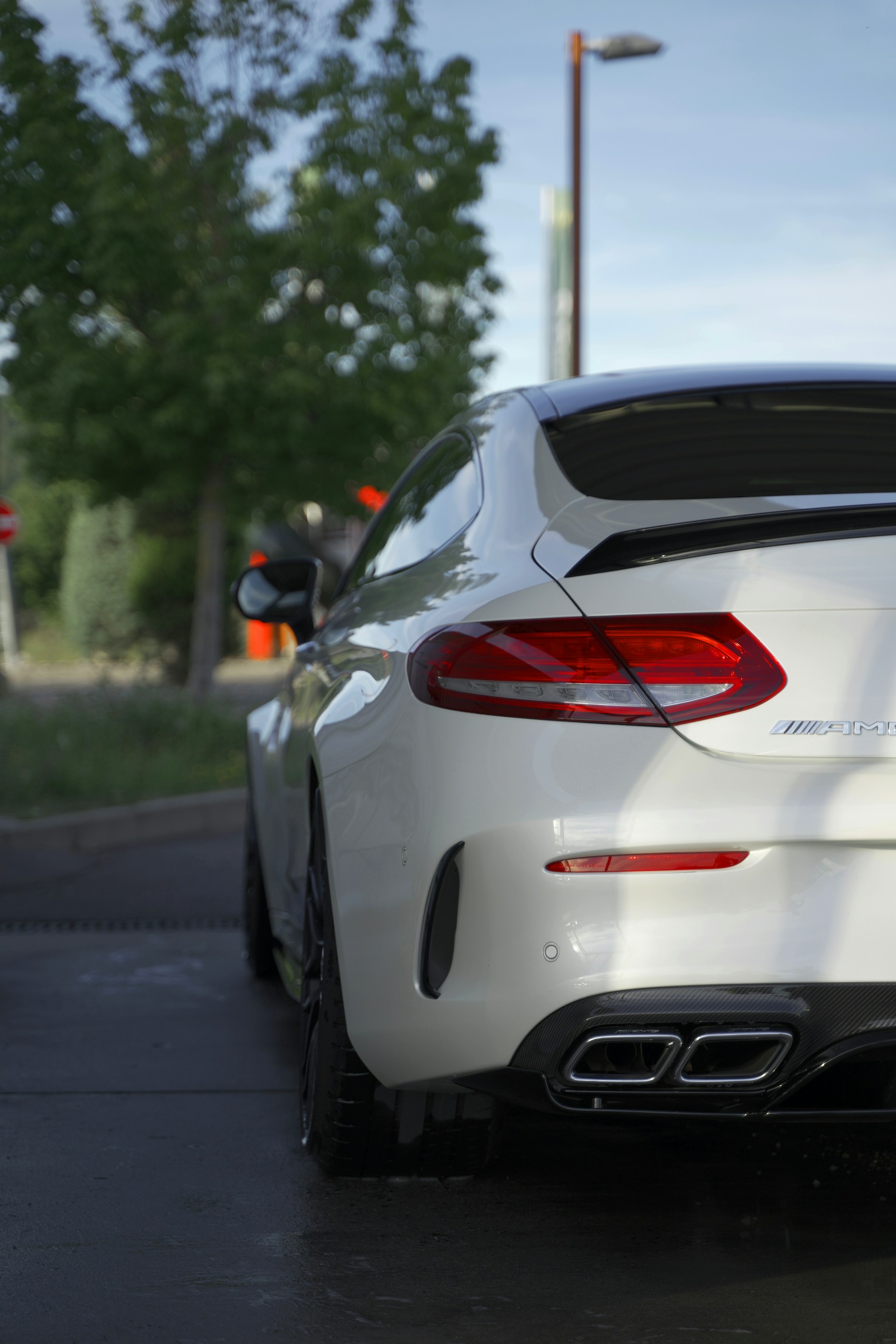 a white car parked on a street