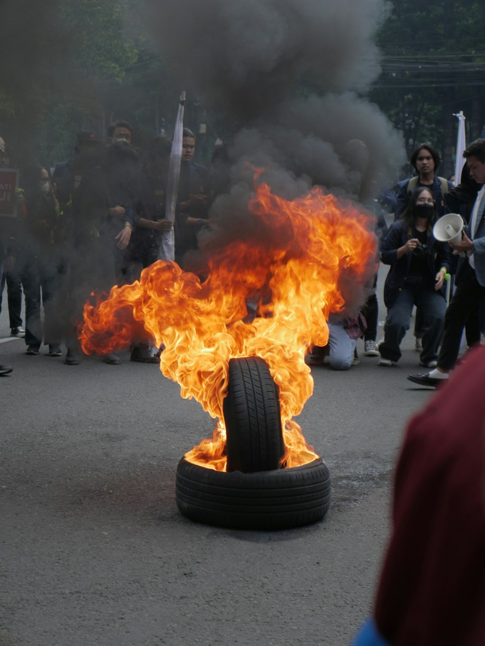 a large bonfire with people around it