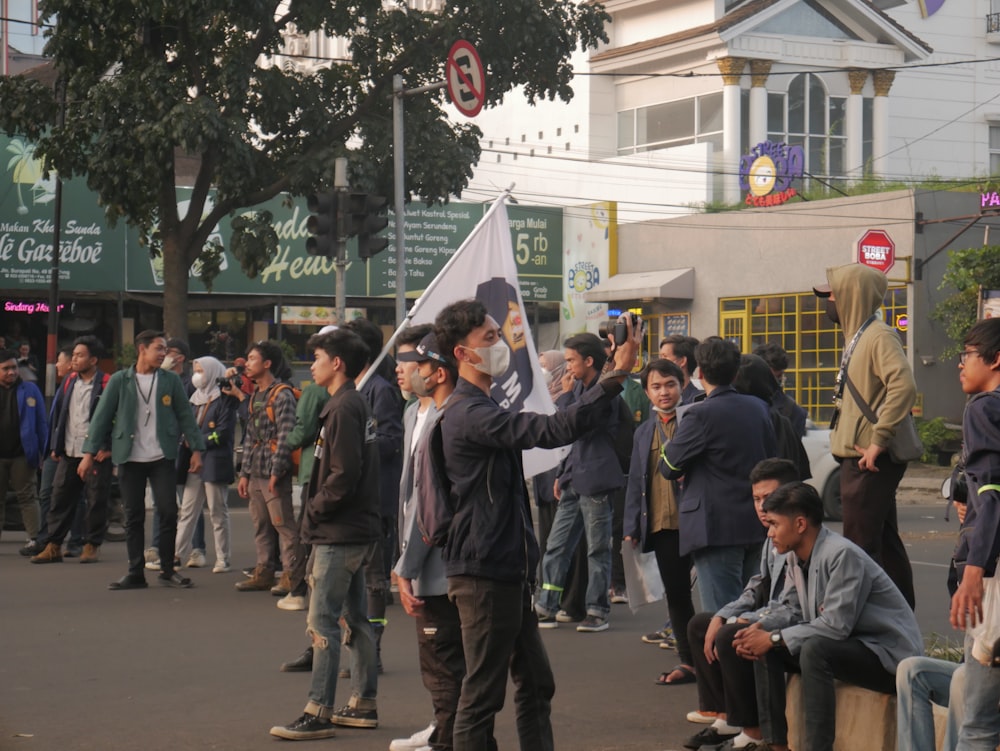 a group of people standing on a street