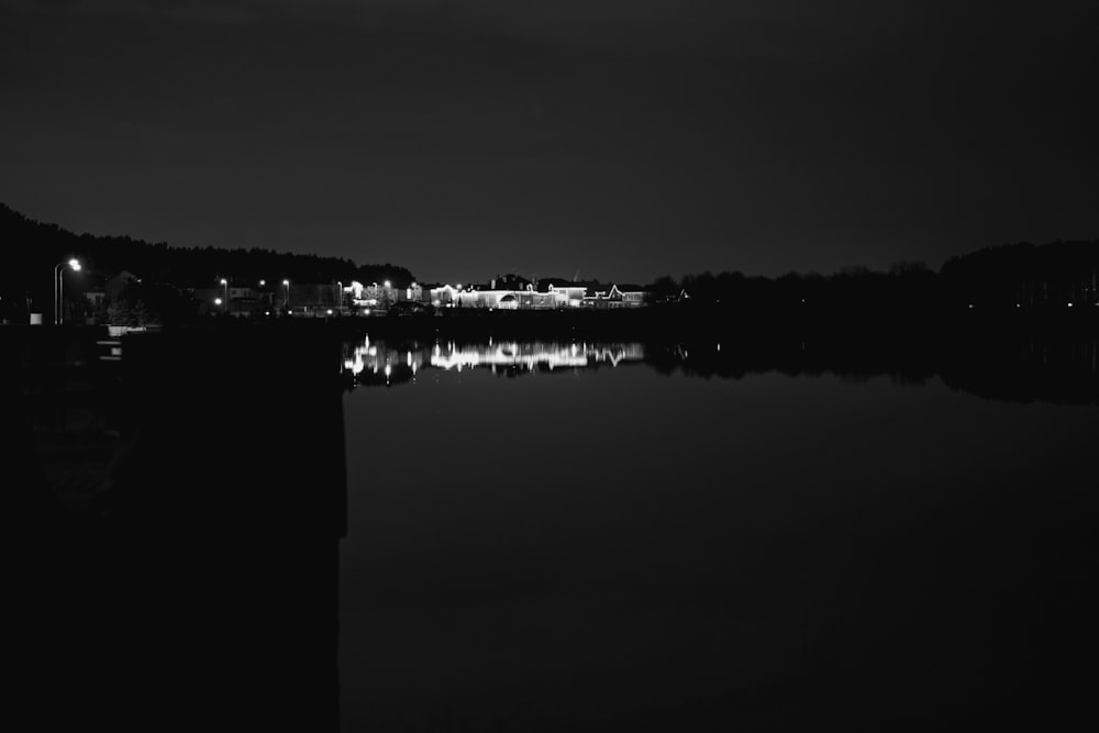 a body of water with buildings in the background