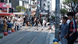 a group of people walking on a street