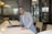 A happy lawyer using Praetor Lab software in an office setting.