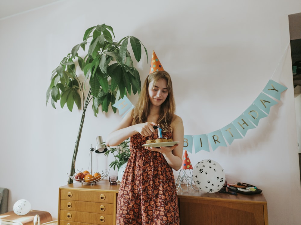 a woman holding a plate of food