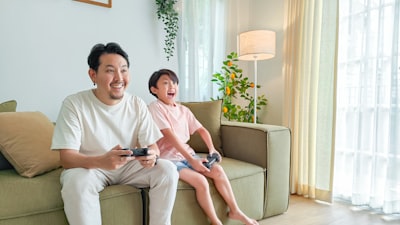 happy gamers playing a game in their language on the console