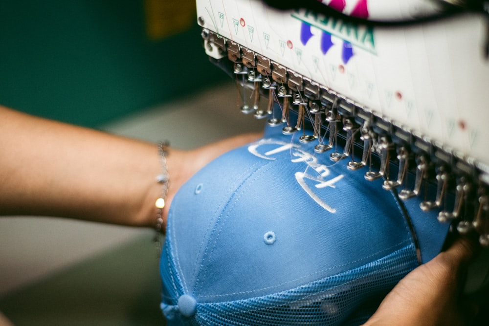 a person holding a blue object