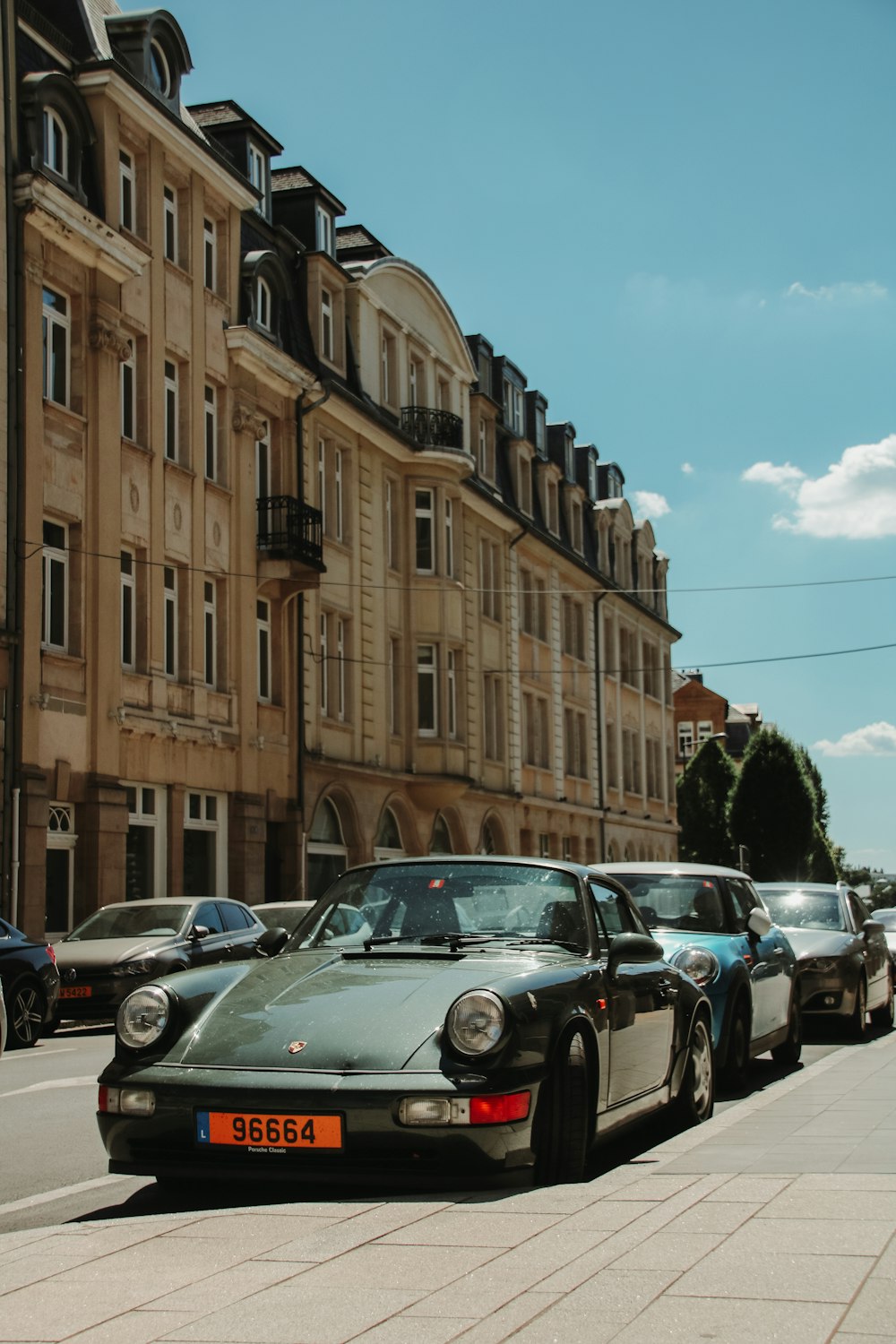 a row of cars parked on the side of a street