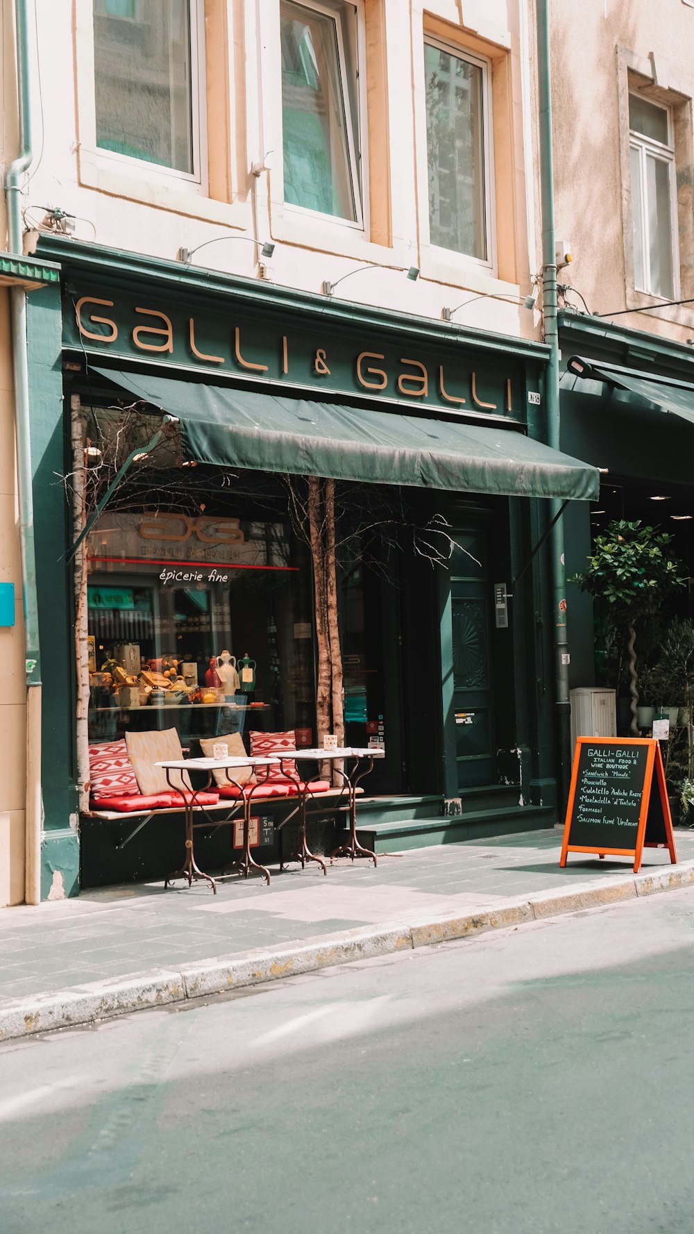 a store front with a green awning