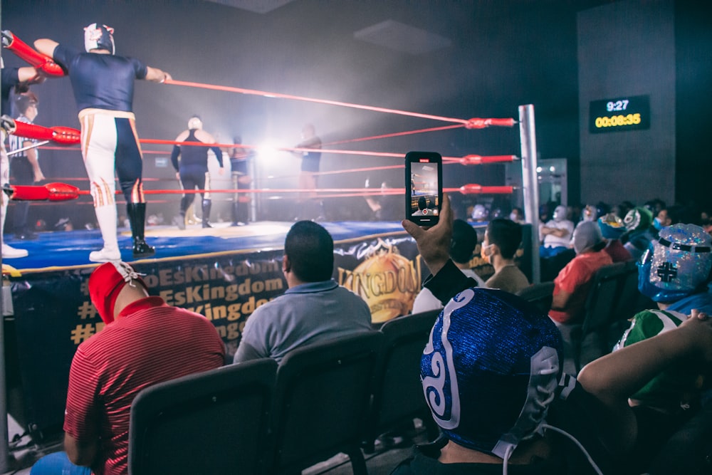 a group of people in a wrestling ring