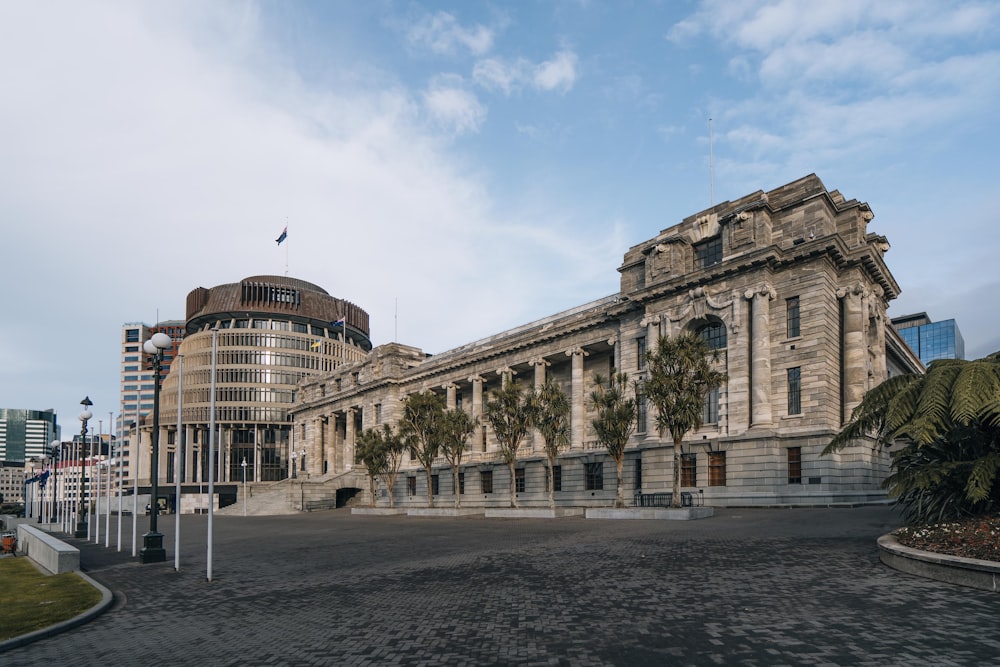 a stone building with palm trees