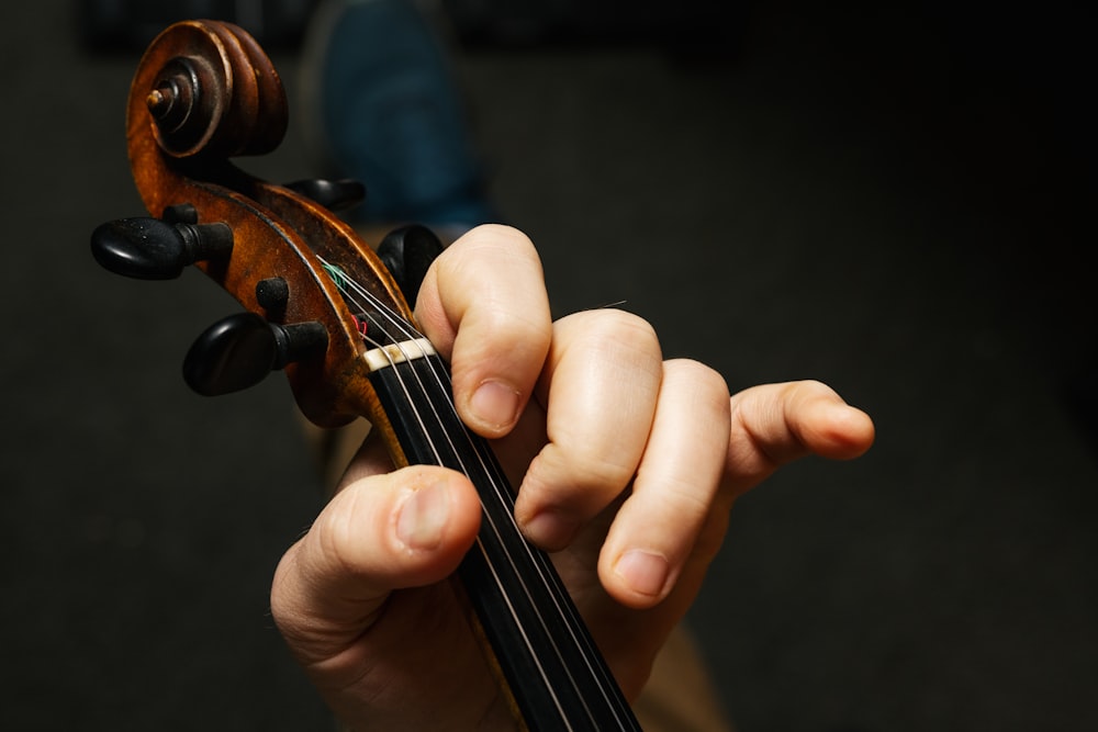 a person holding a violin