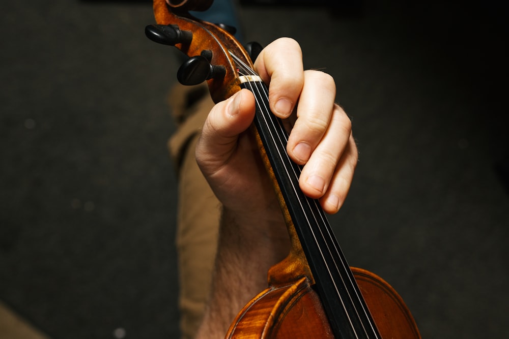 a person playing a violin