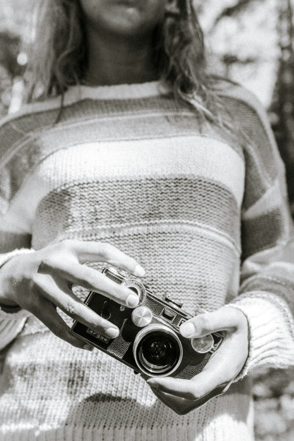 a woman holding a camera