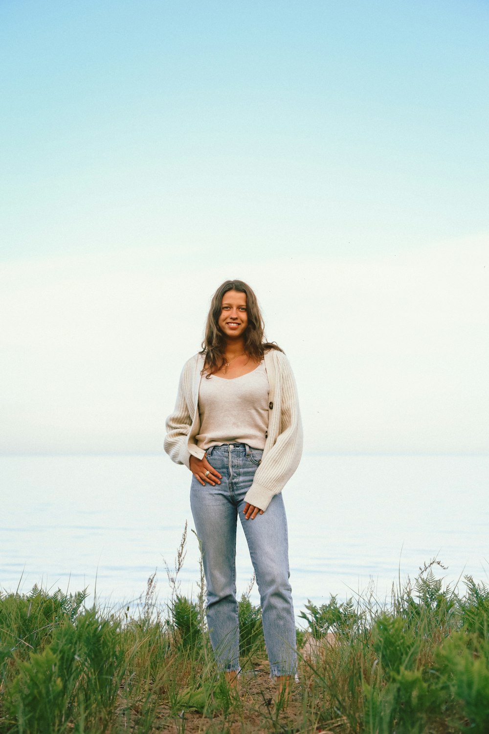 a person standing in a grassy area