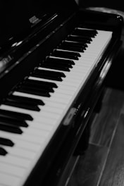 a piano keyboard with a blurry background