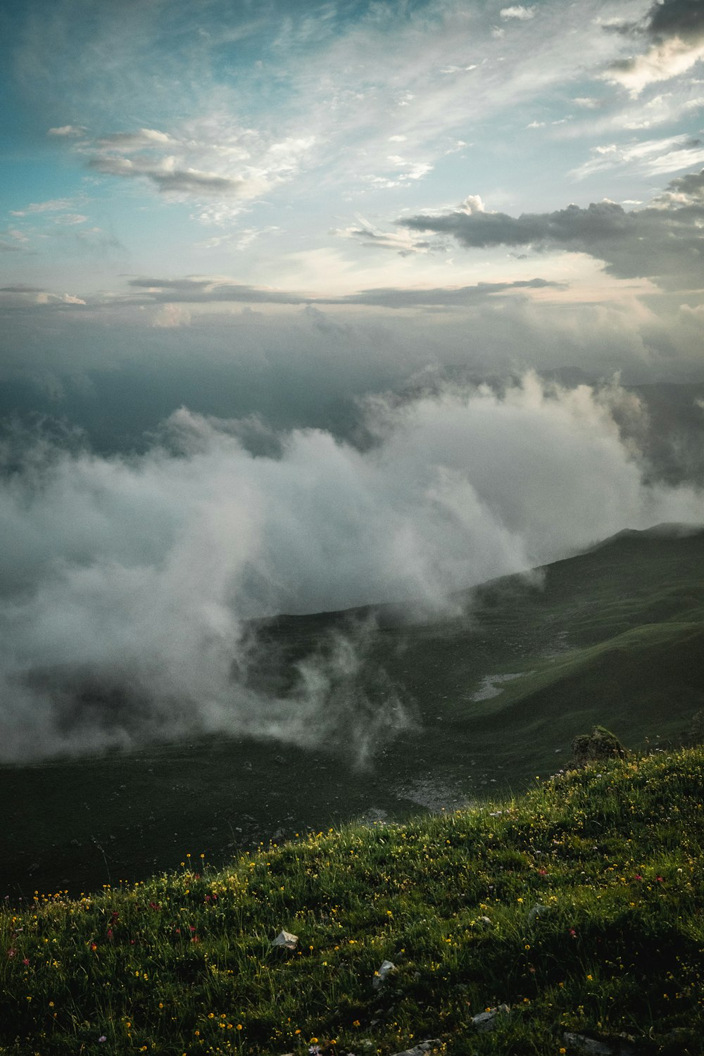 a view of a valley with clouds