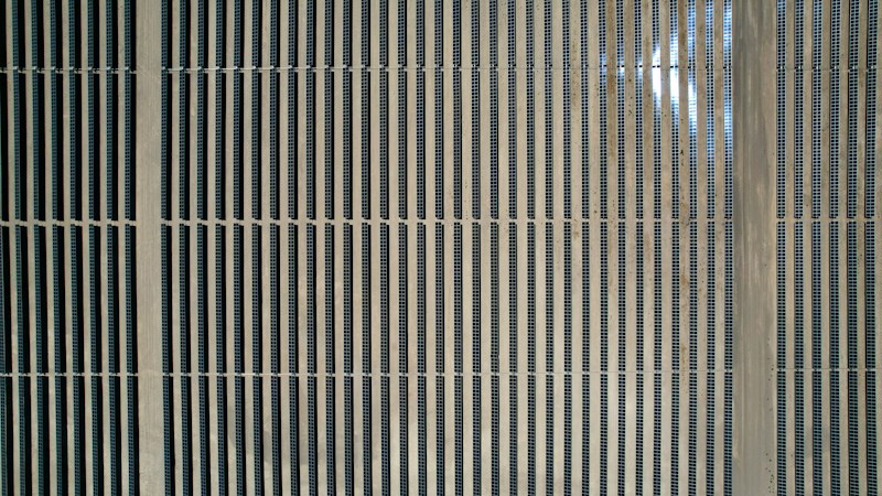 Rows of solar panels covering open desert ground, the current lease use on Boulder City land in the Eldorado Valley