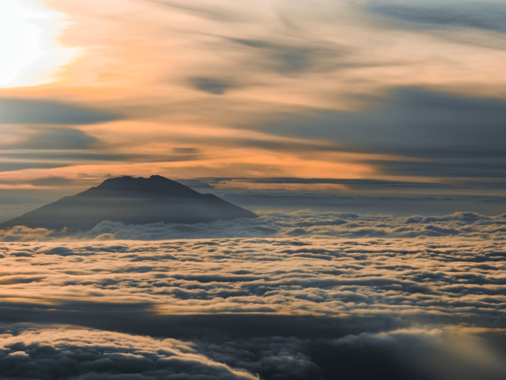 a mountain in the clouds