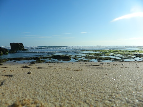 a rocky beach with waves crashing