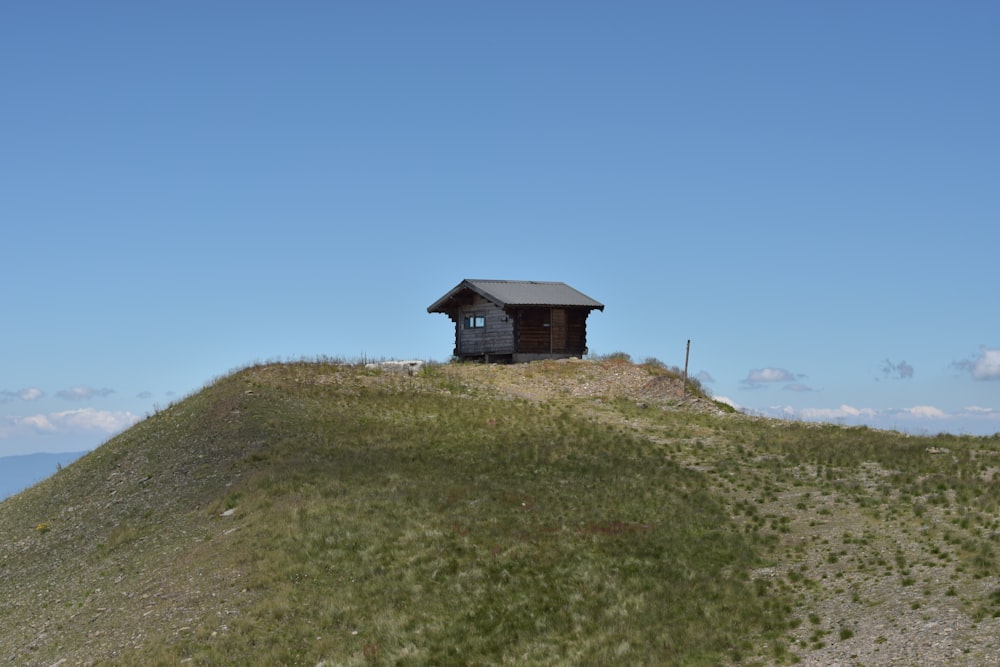 a small building on a hill