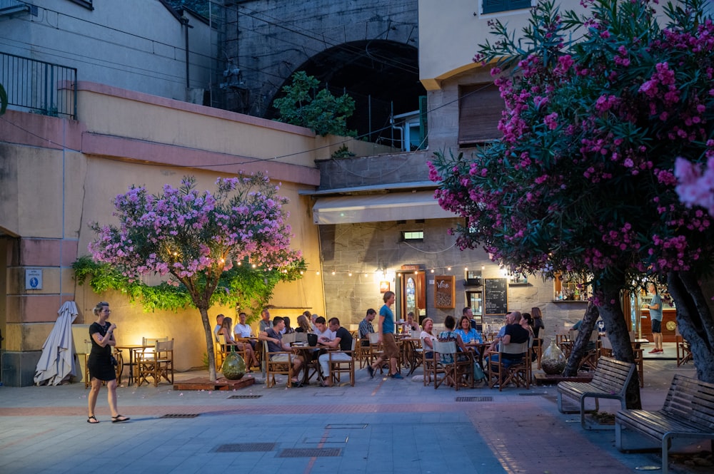 a group of people sitting outside a building