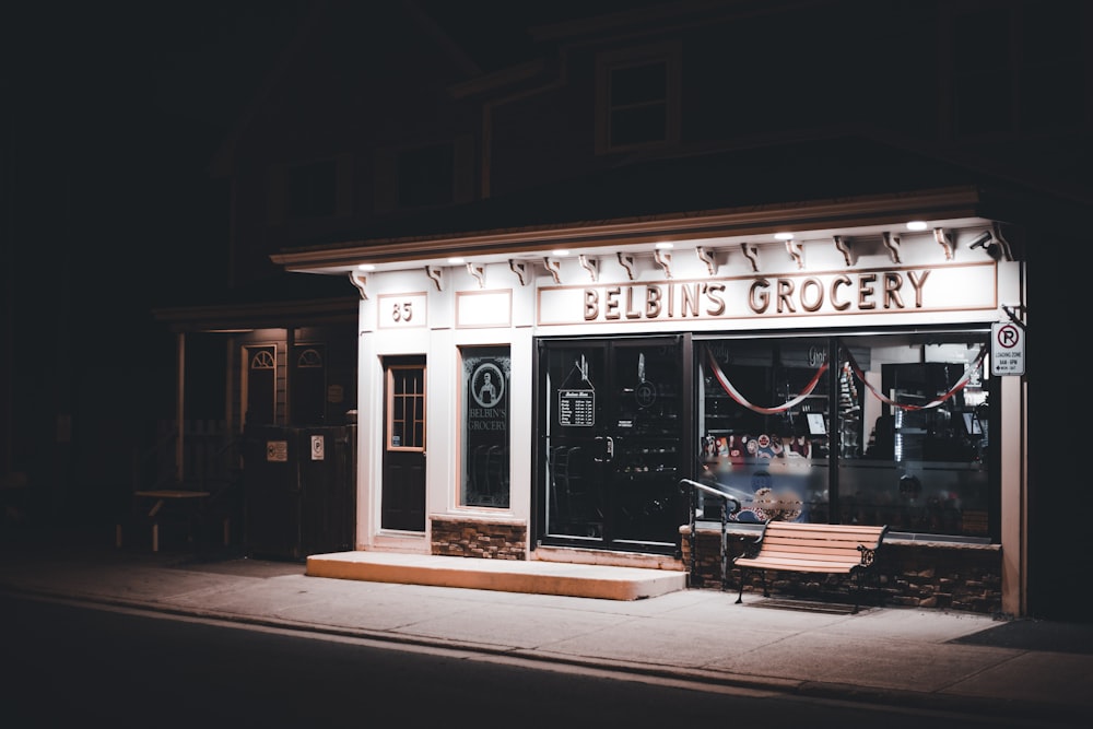 a store front with a bench