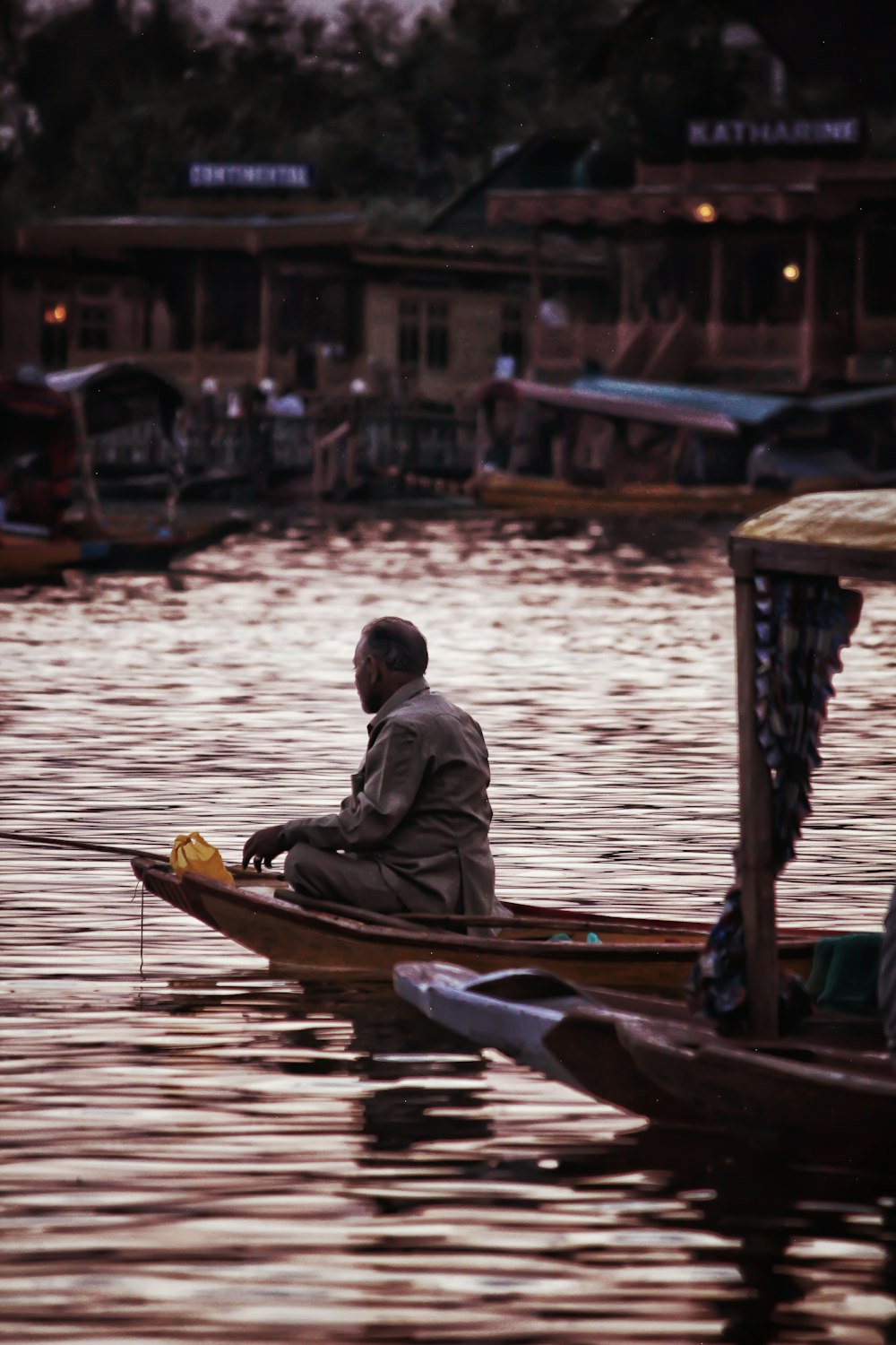 a man in a boat on the water