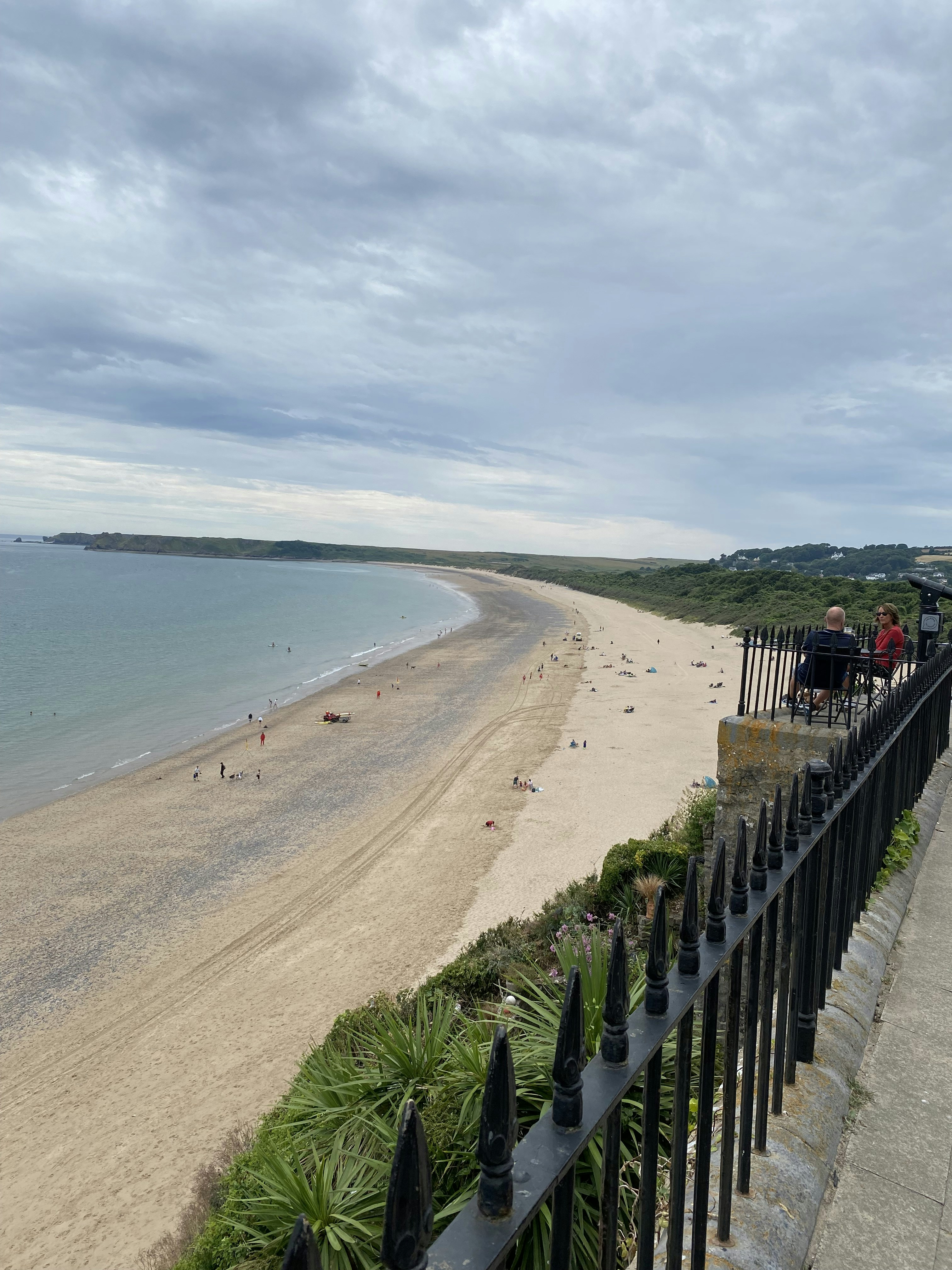 a beach with people on it