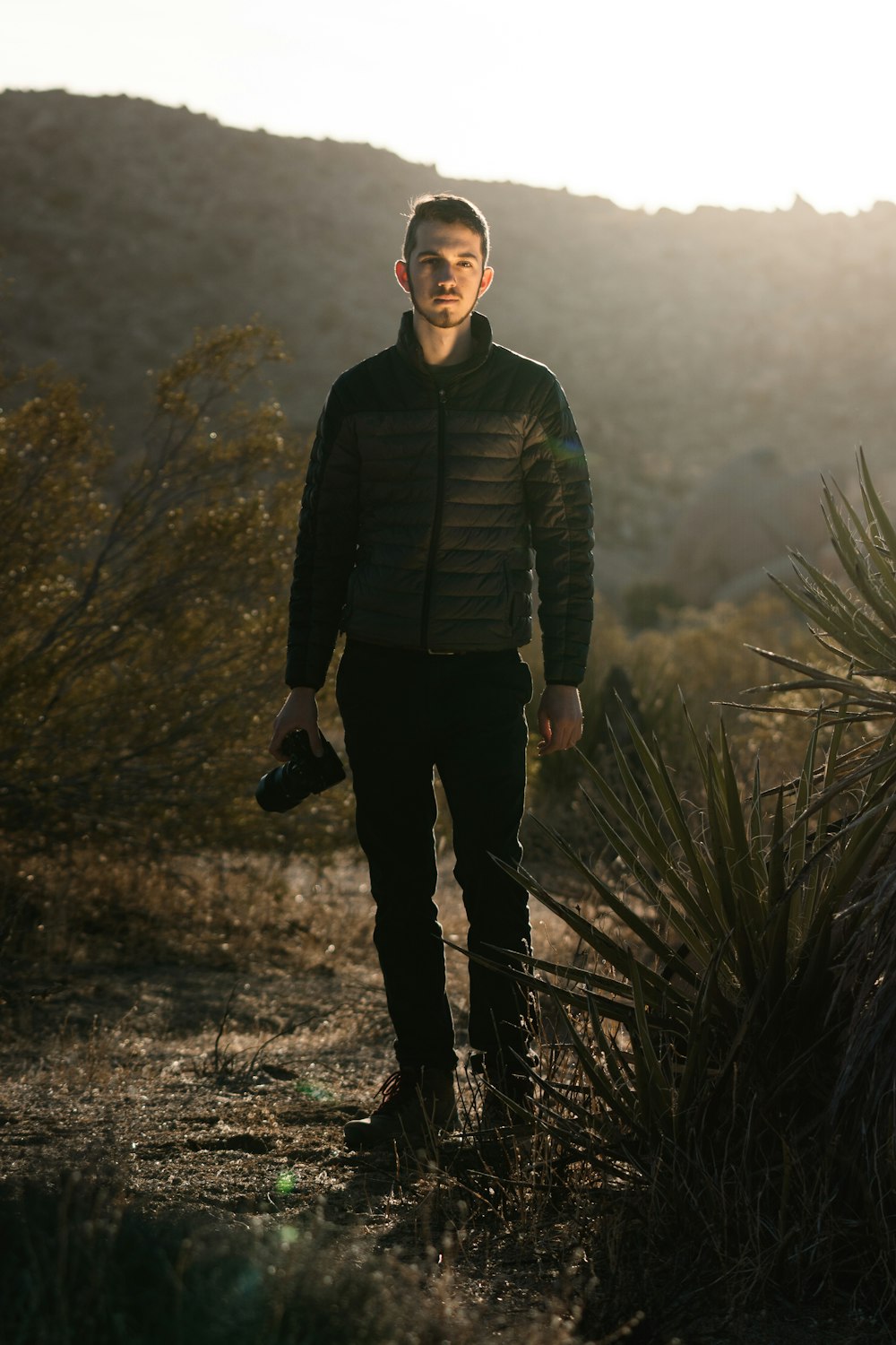 a man standing on a trail