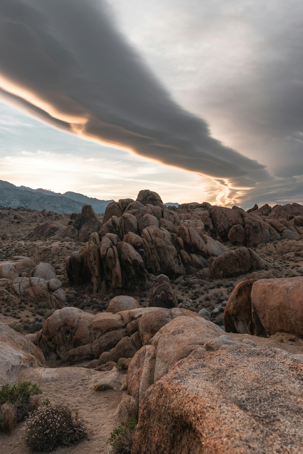 a rocky area with a cloudy sky