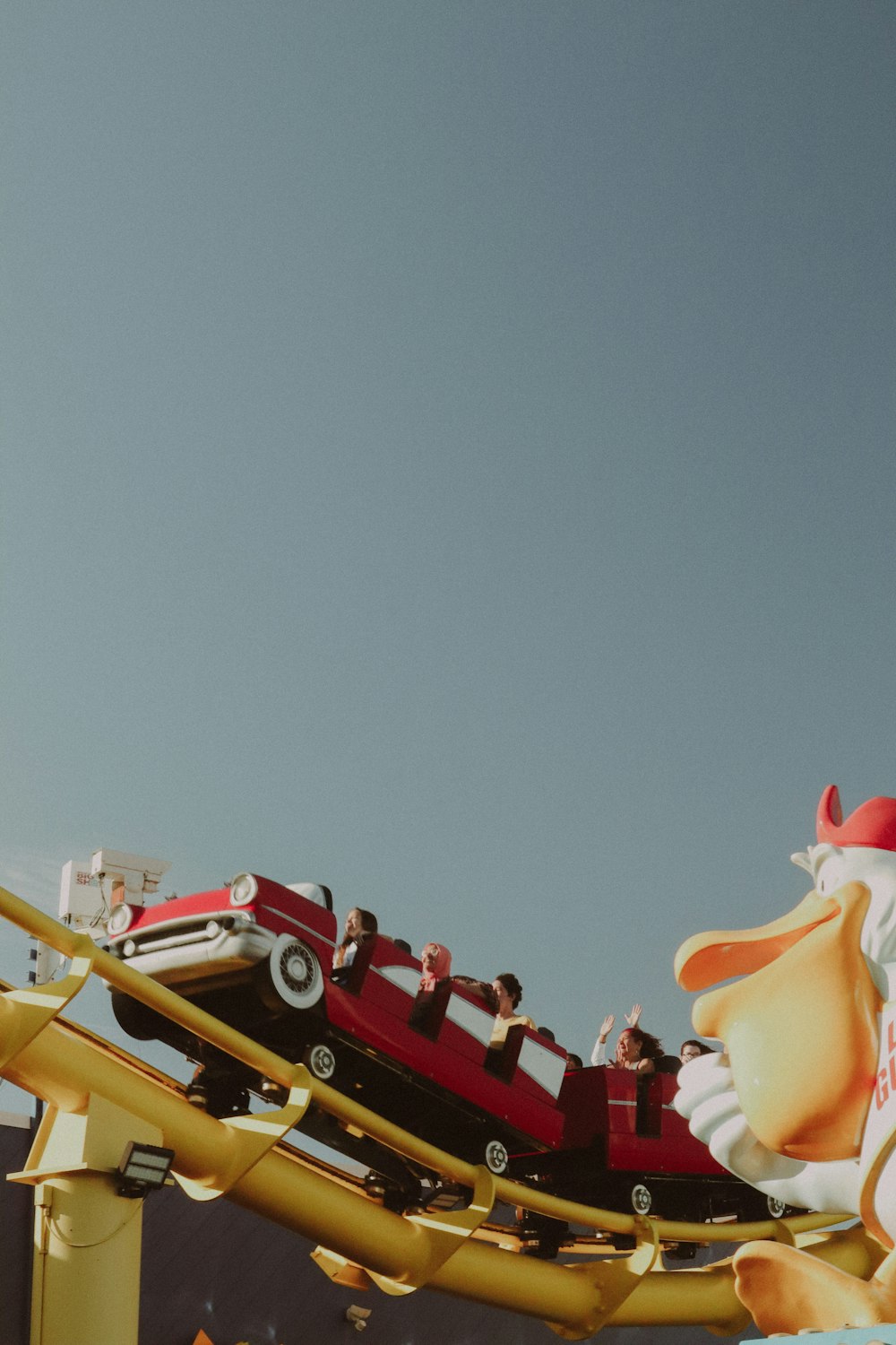 a group of people riding a roller coaster