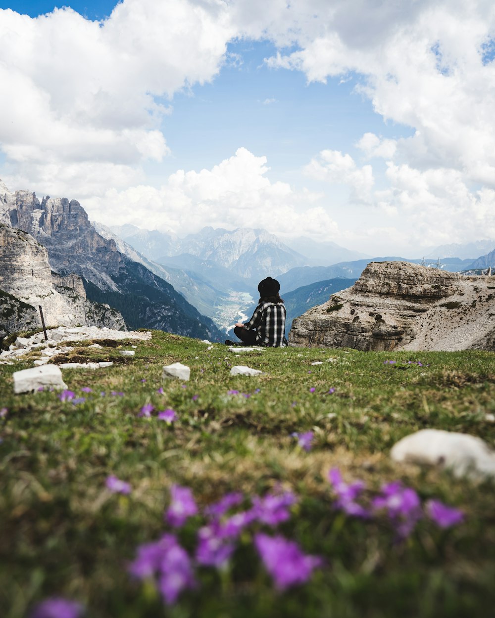 a person sitting on a rock