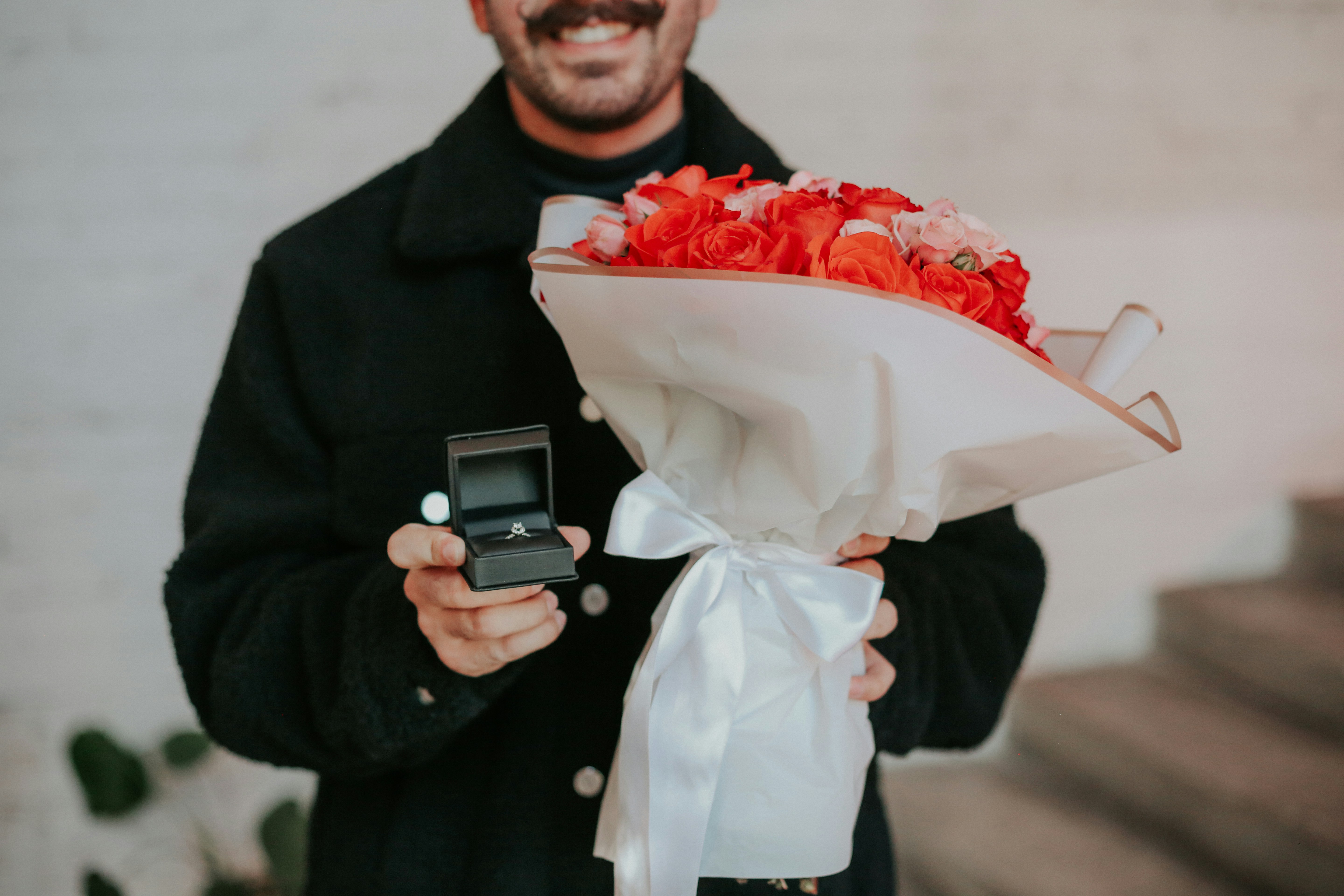 A person holding a bouquet of flowers