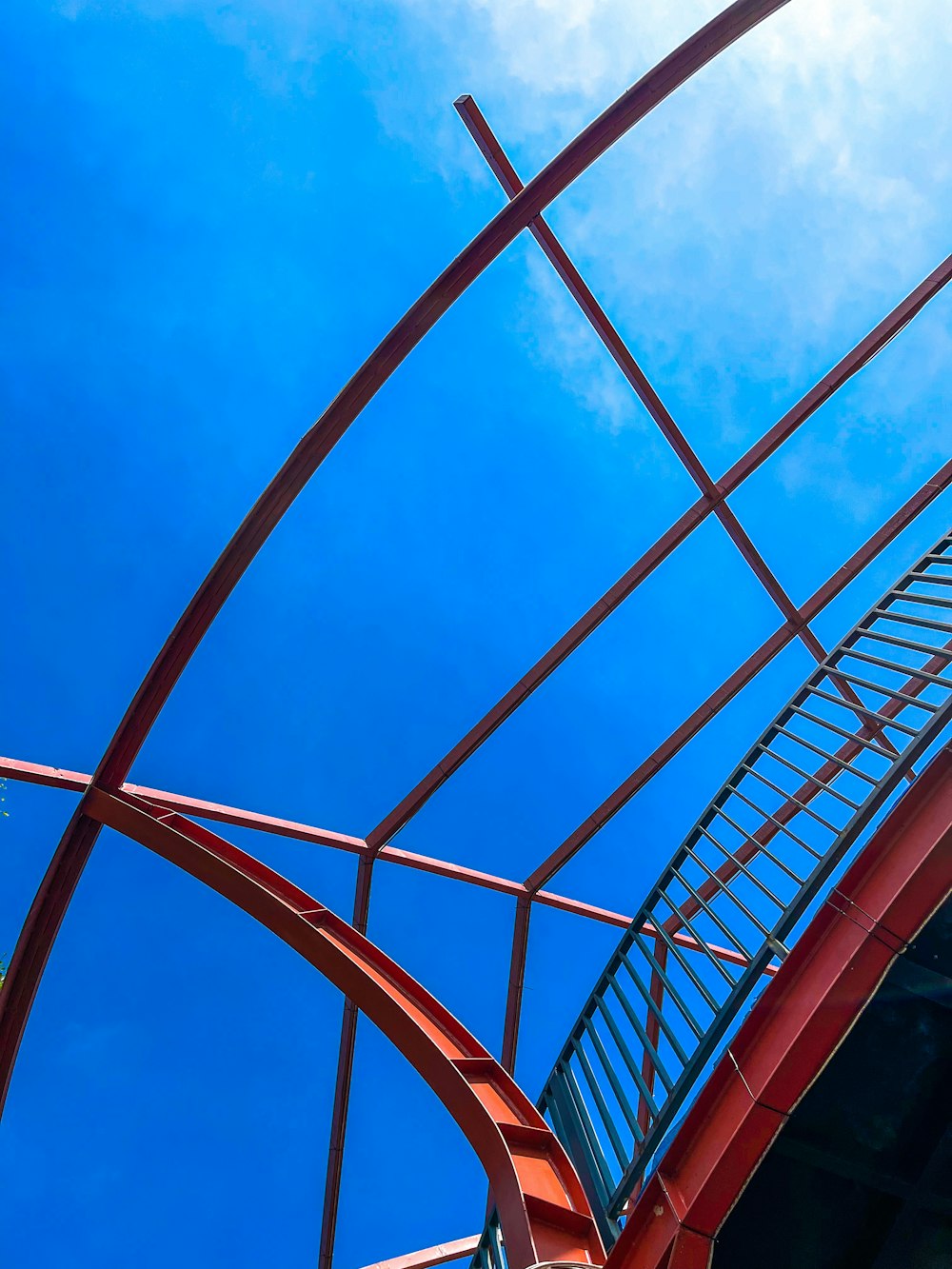 a roller coaster with a blue sky