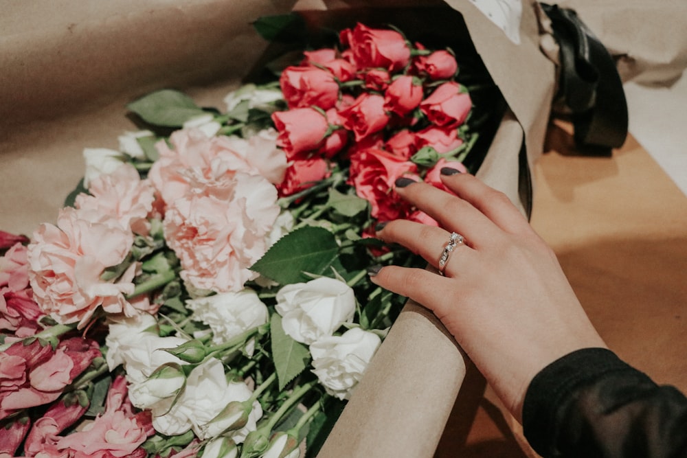 a person holding a bouquet of flowers