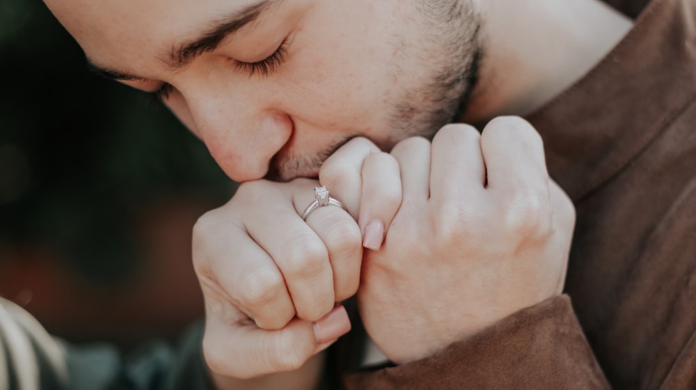 a man holding a ring