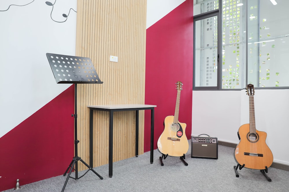 a couple of guitars on a stand