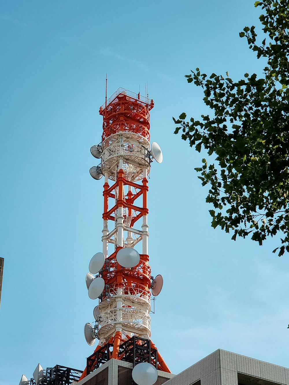 a tall tower with satellite dishes