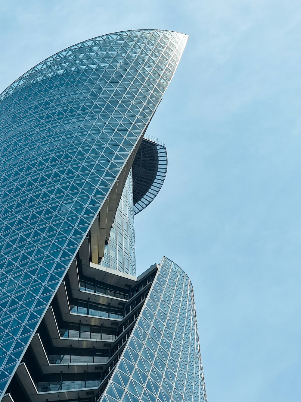 a tall building with a glass front