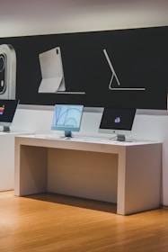 a desk with a computer and a monitor on it