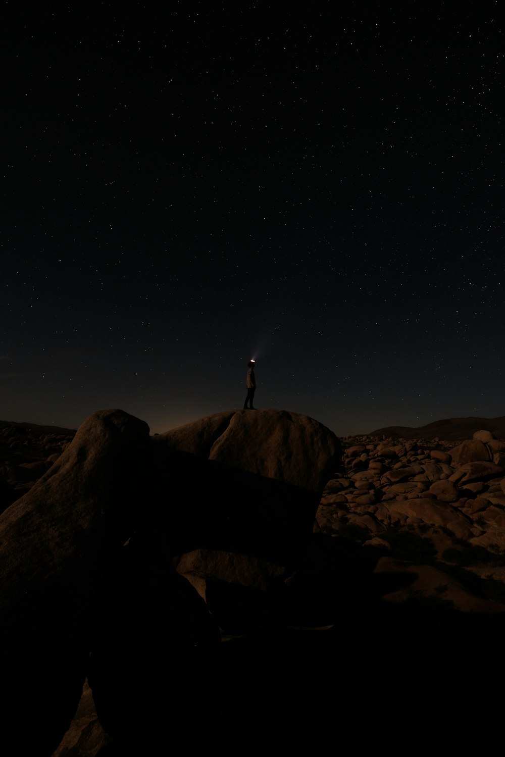 a person standing on a rock