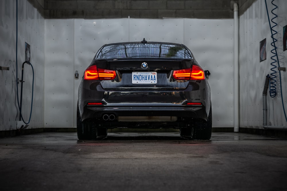 a black car parked in a garage