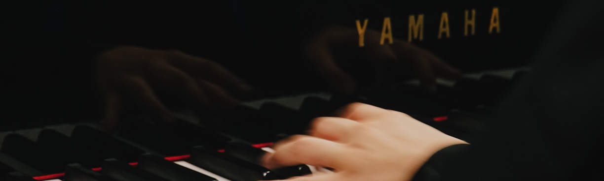 a hand on a white keyboard