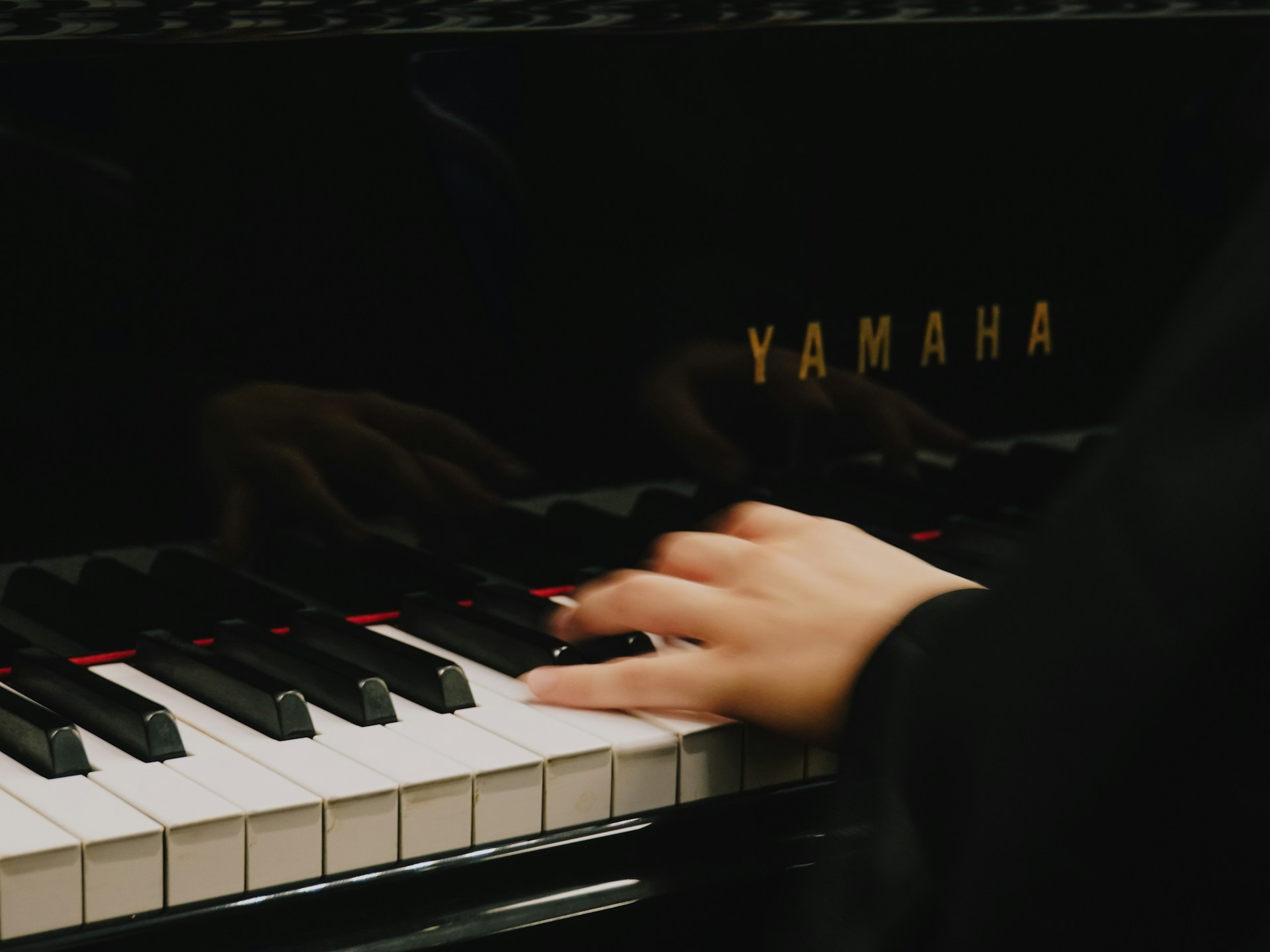 a hand on a white keyboard