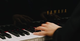 a hand on a white keyboard