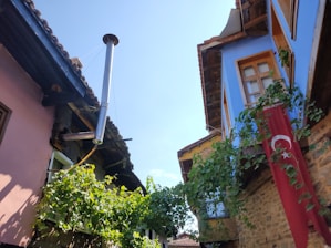 A vibrant Turkish village scene with traditional houses and people helping each other.