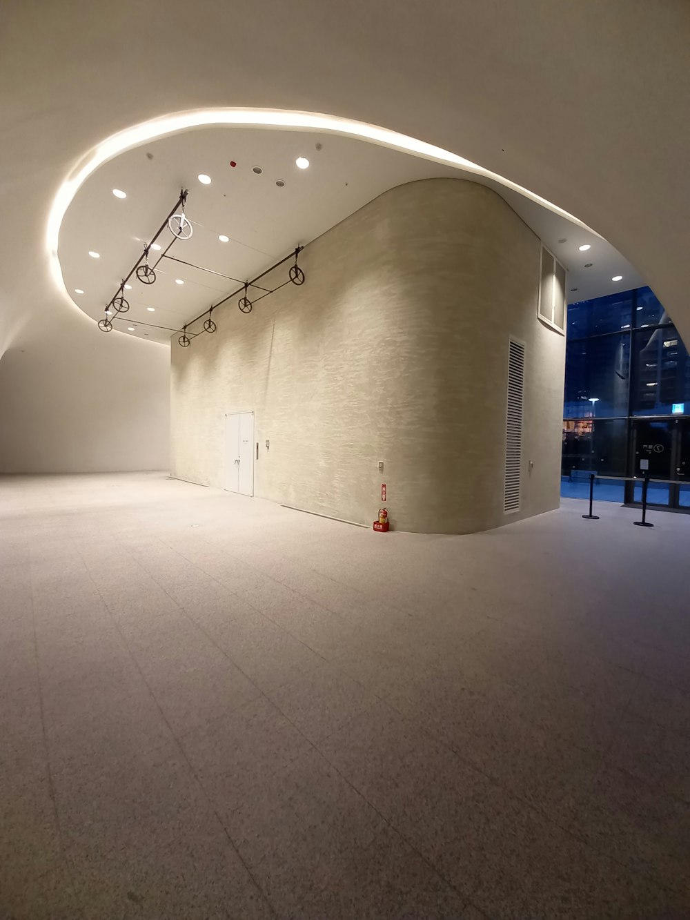 a large white room with a large ceiling and a large white ceiling